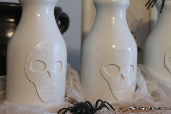 skull vase pottery barn knock off, crafts, halloween decorations, seasonal holiday decor, Grab your thrift store bottles and get started