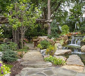 backyard oasis with pond and waterfalls, gardening, outdoor living, ponds water features, Stone pathways invite you to explore the expanse of this backyard oasis
