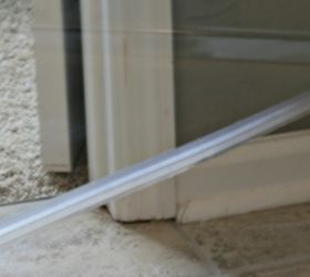 How to Clean the Plastic Strip at the Bottom of a Glass Shower Door