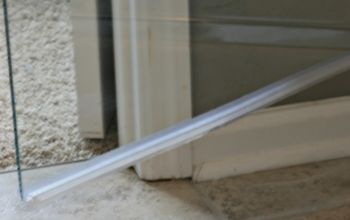How to Clean the Plastic Strip at the Bottom of a Glass Shower Door