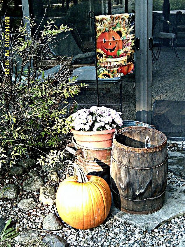 fall deco at the small house using found objects and autumn s bounty, patriotic decor ideas, seasonal holiday d cor, A copper boiler filled with mums an old nail keg and a hand forged flag made in my husband s blacksmith forge