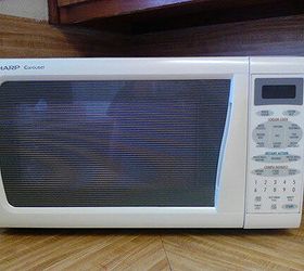 how to clean and disinfect the microwave with just vinegar and water, Step 3 Allow the measuring cup or bowl to remain in the microwave for approximately five minutes so that the steam can accumulate inside the oven