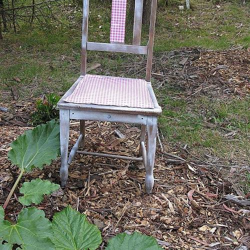 some more garden art, gardening, outdoor living, repurposing upcycling, succulents, Roadside find old oak chair since gave it another blast of white paint in situ amongst the rhubarb