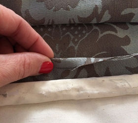recovering roman shades no sew of course, Turn up the bottom edge of the shade Determine whether you want clean edges If the shade will face a street or you are a perfectionist you will want clean edges To do this fold the fabric edge over half way