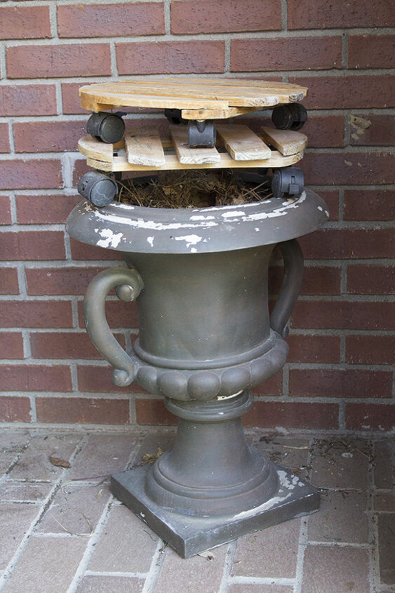 can someone tell me what bird this is, pets animals, This is where the nest is on our front porch inside the planter and underneath the wooden things