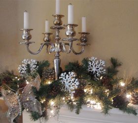 christmas mantel, christmas decorations, seasonal holiday decor, Silver candelabras flank each side of the mantel with greenery lights silver snowflakes and whimsical butterflies