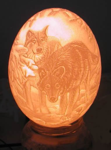 ostrich egg carvings, home decor, Wolfs intaglio carving lit from the inside