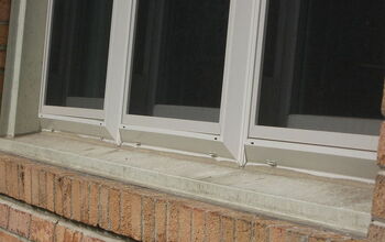 I went out to this home to investigate why mold was growing from the aluminum trim around a replacement window.