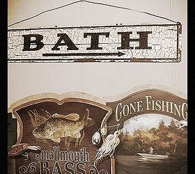 a mirror trim for next to nothing and a fishing lodge rest room tour, home decor, vintage bath sign