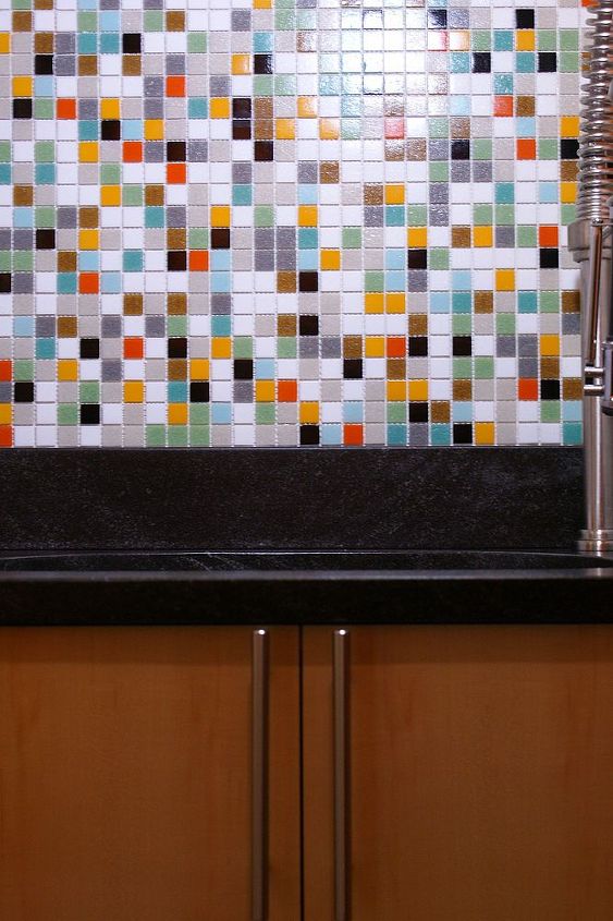 a functional laundry room, Leathered jet mist granite with under mount sink sitting on a custom made maple cabinet and modwalls mosaic tiles above