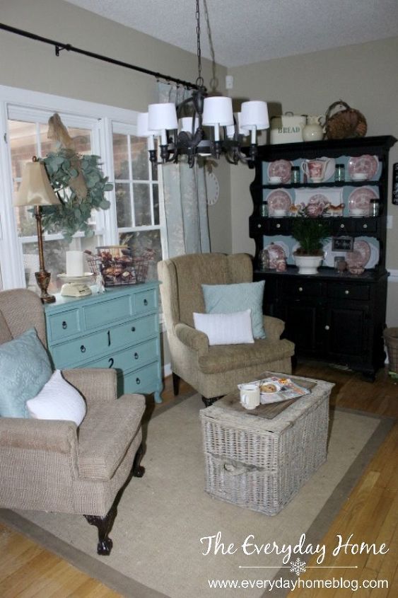 creating a cozy sitting area from another space for virtually free, home decor, living room ideas, painted furniture, A French wicker trunk acts as a coffee table and also holds two throws the grandloves can pull out when they want