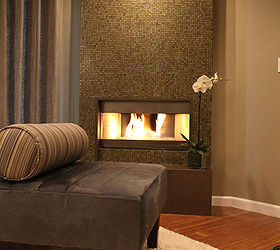 living room design tips 1, fireplaces mantels, home decor, living room ideas, Add Floor to Ceiling Tiles Glass mosaic fireplace tiles are an easy way to spice up a living room design To create a vibrant and contemporary focal point designer Candice Olson suggests adding an elevated fireplace covered in floor