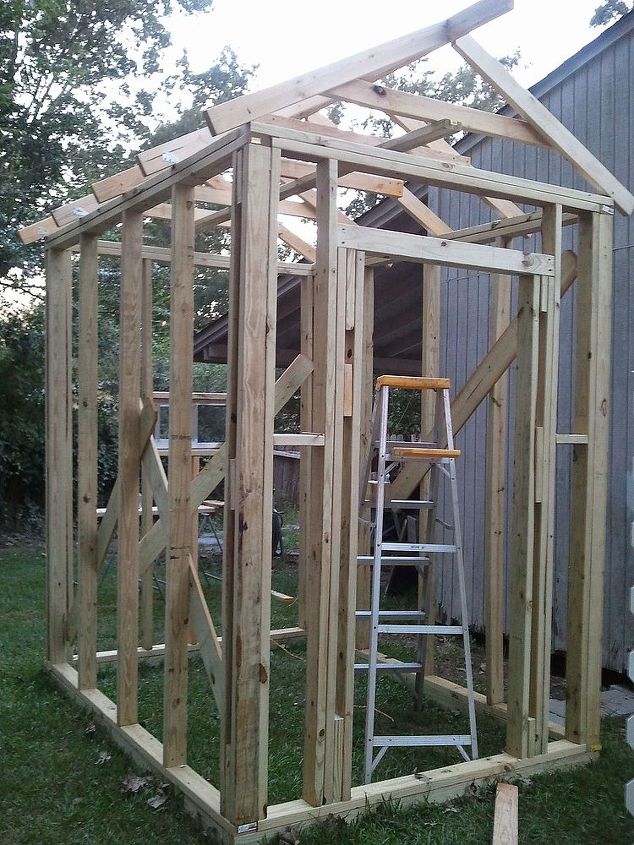 greenhouse built for less than 700, diy, gardening, outdoor living, Walls going up Most of the lumber we already had from other projects Bought pressure treated lumber for base