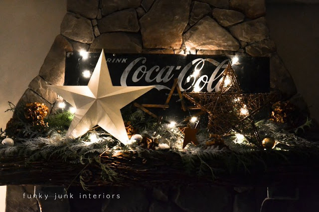 christmas just goes better with coke, christmas decorations, fireplaces mantels, seasonal holiday decor, Here it is lit up at night all glowy and everything A vintage ruler was bent into a star shape to further chime with all things vintage