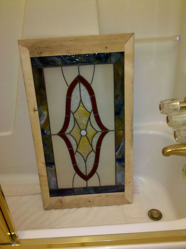 adding a vintage stained glass, bathroom ideas, crafts, home decor, Fortunately I found a vintage window at Scott s Antique Market It was trimmed out and ready to install in the hole where the previous window had been