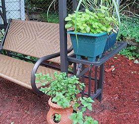 fragrant herbs to make your garden smell wonderful, gardening, lemon balm rosemary and lemon grass in planter on the swing shelf chocolate mint in the strawberry planter nice to smell while enjoying your garden