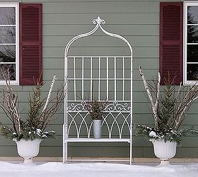 winter floral designs, gardening, porches, The garden arch and urns house seasonal displays through out the year