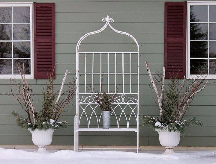 winter floral designs, gardening, porches, The garden arch and urns house seasonal displays through out the year