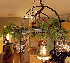using fresh pine as holiday decor, seasonal holiday d cor, Drape branches across pot rack light fixture Use wire to attach if needed