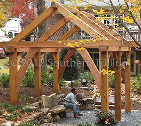 timber frame garden structure, And for a sense of scale here is one of our crew sitting on the bench as we finished clean up