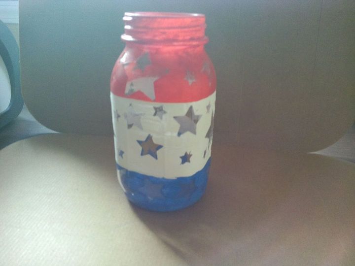 patriotic mason jar luminary, crafts, mason jars, patriotic decor ideas, seasonal holiday decor, I applied the stickers to the middle section and painted over the section with the white paint Now all I had to do was let it dry completely I placed the candle inside and it is ready to light