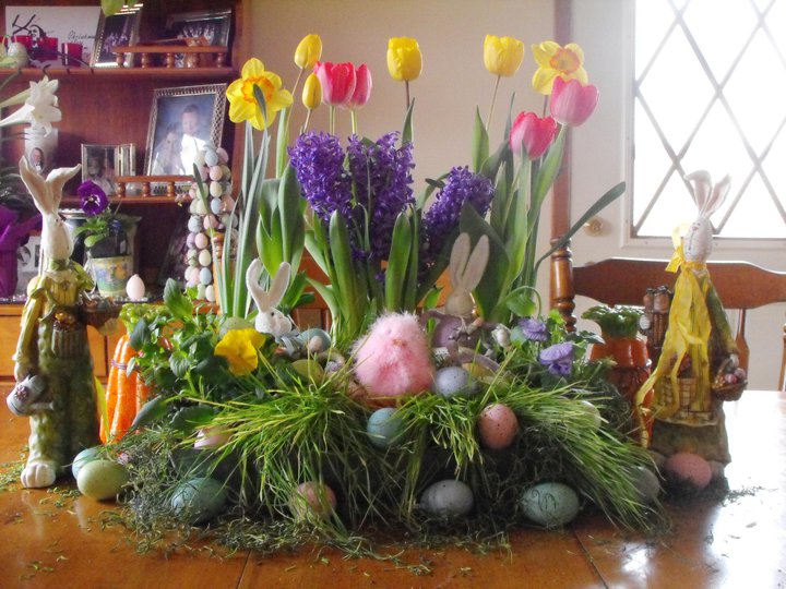 spring, container gardening, easter decorations, flowers, gardening, seasonal holiday d cor, Spring centerpiece with individual pots of tulips crocuses and daffodils tucked into a wooden tray Used Wheat grass a long with eggs and chicks at the bottom