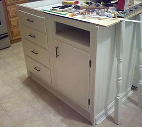 old base cabinets repurposed to kitchen island, I painted the legs and cabinets and attached new hardware