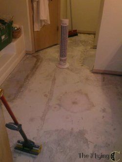 installing a travertine vinyl floor, bathroom ideas, flooring, tile flooring, tiling, The hardest part of the job was removing the carpet tile in front of the tub and old linoleum Would have been an easy job sans linoleum