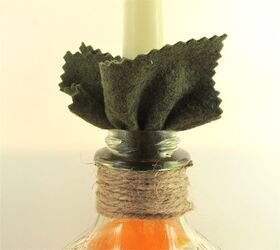 pumpkin re purpose project bottle into a pumpkin candle holder, crafts, halloween decorations, repurposing upcycling, seasonal holiday decor, Wrap candle base in the felt square insert into opening Make sure it will not slip in the bottle
