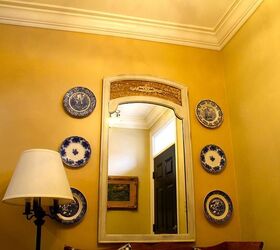 a different rug adds a pop of color to a small space, flooring, foyer, home decor, window treatments, To get more blue in the space I hung old plates beside the mirror