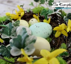 an easy spring bird nest with speckled eggs project, crafts, seasonal holiday decor, wreaths, Bits of ivy forsythia and moss decorate this pre made grapevine nest