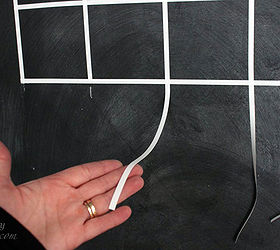 diy chalkboard calendar, chalkboard paint, crafts, painting, wall decor, Connect the vertical tick marks with vinyl lines If you have excess vinyl snip it short with a pair of scissors Our calendar is 20 tall
