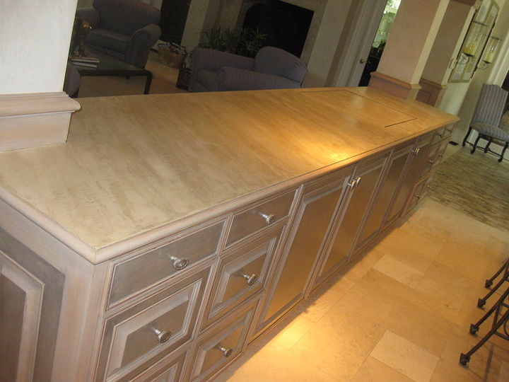 a resurfacing product called skimstone, countertops, A client recently asked me to resurface her counter top between the kitchen and the family room Weight and durability was a concern because if you look at the far end of the counter there is an opening under which a TV is hidden