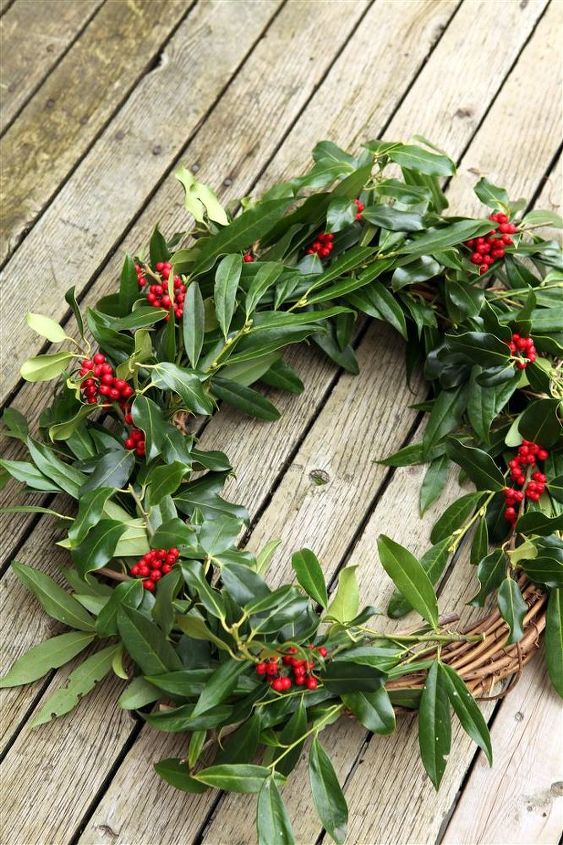 making a fresh evergreen wreath, crafts, doors, flowers, gardening, hydrangea, seasonal holiday decor, wreaths, Continue adding bunches of greens and reds until the wreath is all filled up Secure each bunch well with the twine