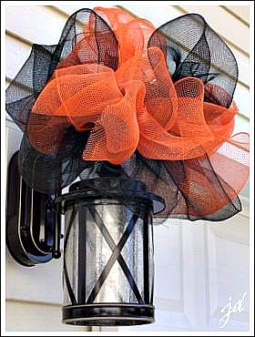 mesh ribbon is my best friend, crafts, garages, halloween decorations, I purchased my mesh ribbon from the craft store It holds up fantastic in all kinds of weather No droopy bows