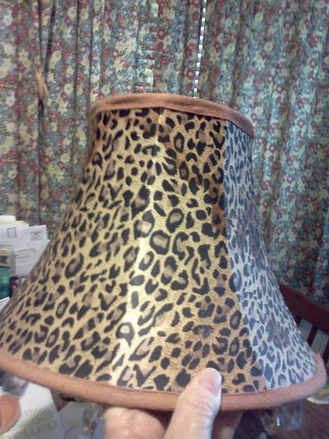 lamp shade needs cleaning and how do i get this ugly stains out, see stains on the outside of shade this was cause by a leaking AC