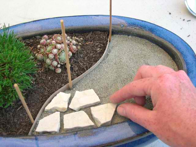 create your very own miniature garden patio, crafts, gardening, You will put down your border edging lay sand tile pieces and you will add the grout