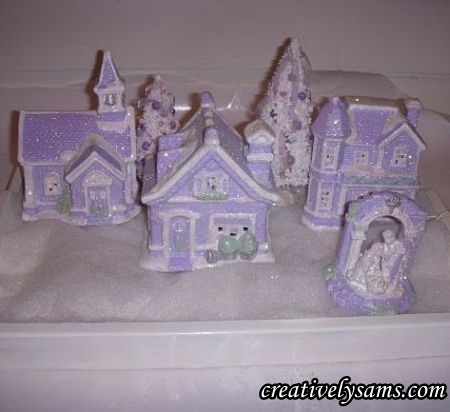 shabby chic lilac village, christmas decorations, crafts, decoupage, painting, seasonal holiday decor, shabby chic, Add a string of 10 lights to a tray that is lined with quilt batting Add the village pieces on top