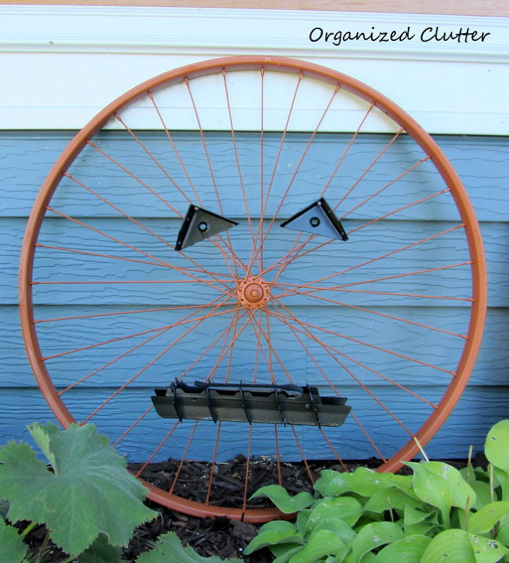 an up cycled bicycle wheel garden pumpkin, crafts, repurposing upcycling, seasonal holiday decor, Garden Pumpkin or Jack O Lantern in the Fall