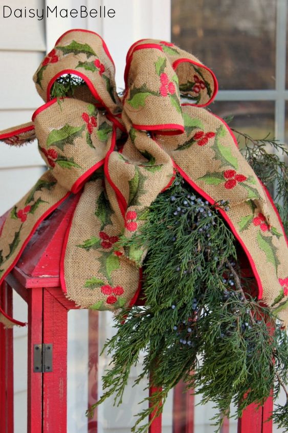 decorating my front porch for christmas, christmas decorations, porches, seasonal holiday decor, The lantern is topped with a burlap bow and more cedar