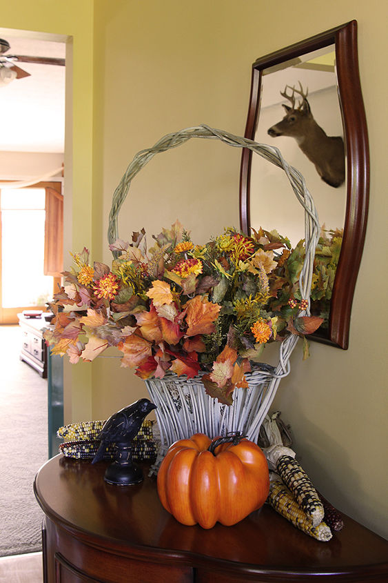 eclectic fall decor in my living room, repurposing upcycling, seasonal holiday d cor, My funeral basket wedding basket holds some dried fall flowers