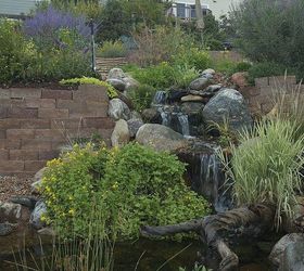 water features through walls, gardening, landscape, outdoor living, ponds water features, wall decor, How about this as the focal point in your yard instead of a stone retaining wall