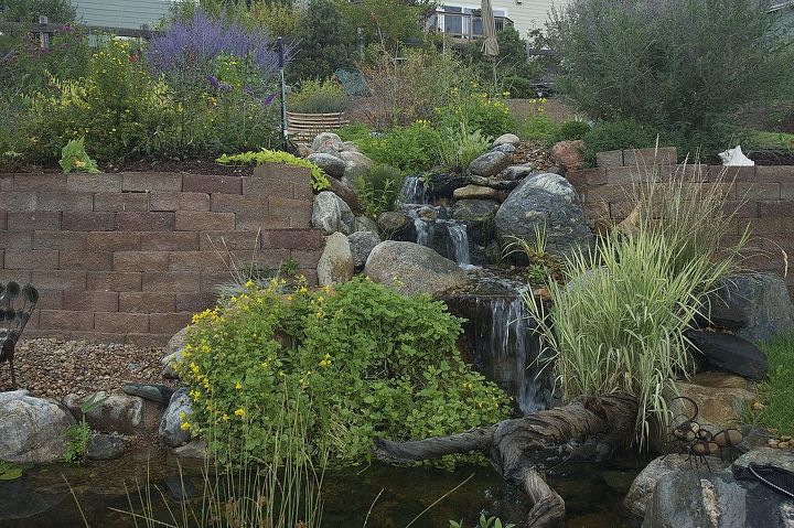 water features through walls, gardening, landscape, outdoor living, ponds water features, wall decor, How about this as the focal point in your yard instead of a stone retaining wall