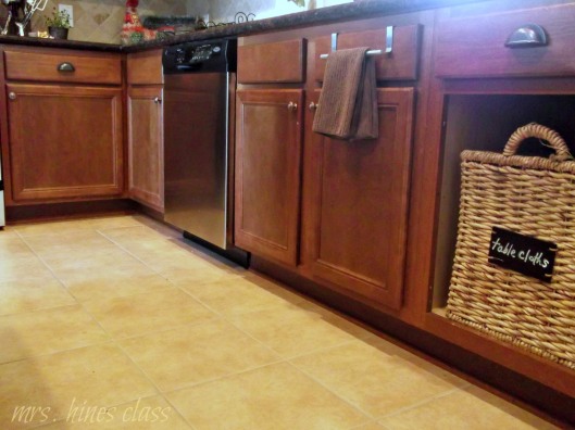 french country kitchen, home decor, kitchen design, replacing a cabinet door with a basket is a simple way to make a big impact