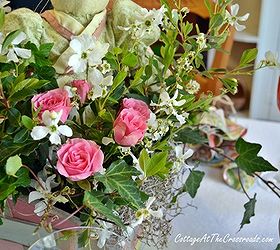 a tablescape for easter, easter decorations, seasonal holiday d cor, Grocery store roses ivy and blooms from the yard made a pretty centerpiece