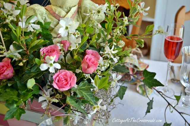 a tablescape for easter, easter decorations, seasonal holiday d cor, Grocery store roses ivy and blooms from the yard made a pretty centerpiece