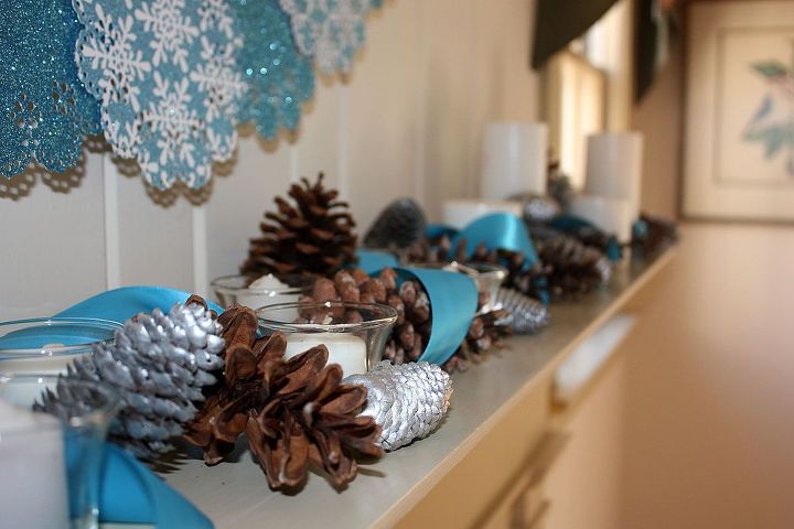 winter mantel, fireplaces mantels, living room ideas, seasonal holiday decor, wreaths, Candles ribbons and pine cones create an easy winter look