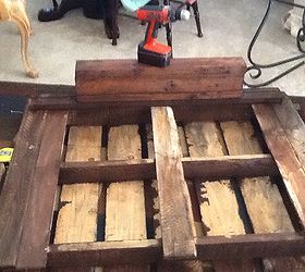 pallet coffee table be proud of what you accomplish, diy, home decor, living room ideas, painted furniture, pallet, repurposing upcycling, Almost there putting cast iron wheels