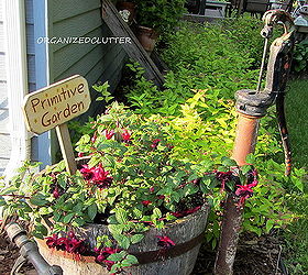 garden junk fuschias, gardening, outdoor living, repurposing upcycling, An old rusty pump