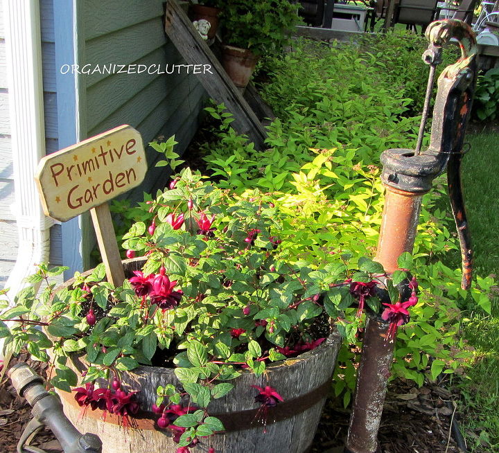 garden junk fuschias, gardening, outdoor living, repurposing upcycling, An old rusty pump